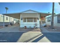Charming single-wide home with carport and landscaping at 9333 E University Dr # 177, Mesa, AZ 85207