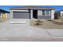 One story home with gray exterior and two car garage at 24078 W Pecan Rd, Buckeye, AZ 85326