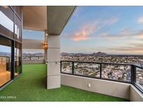 Spacious balcony with artificial turf and stunning city views at 1040 E Osborn Rd # 1902, Phoenix, AZ 85014