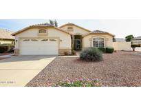 House exterior with a two-car garage and rock accents at 20107 N 110Th N Ave, Sun City, AZ 85373