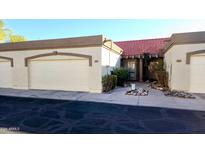 Spanish style home with two-car garage and courtyard entry at 1319 E Marny Rd, Tempe, AZ 85288