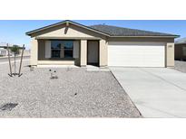 One-story home with light beige exterior and gravel yard at 201 S Apache Ave, Eloy, AZ 85131