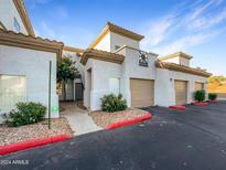 Exterior view of condo building with parking at 3236 E Chandler Blvd # 2066, Phoenix, AZ 85048