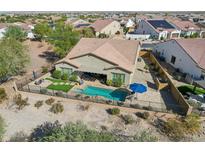 Aerial view of a home with a private pool and landscaped backyard at 14204 S 179Th Ln, Goodyear, AZ 85338