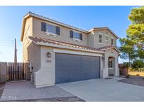 Two-story house with gray garage and landscaping at 38318 N La Grange Ln, San Tan Valley, AZ 85140