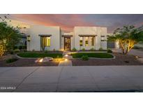 Modern house exterior with landscaped yard and lighting at 30927 N 117Th Dr, Peoria, AZ 85383