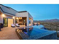 Luxury infinity pool and patio with mountain views at 4880 E Lone Mountain N Rd, Cave Creek, AZ 85331