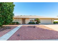 Ranch style home with brick facade, double car garage and landscaping at 13247 W Bellwood Dr, Sun City West, AZ 85375