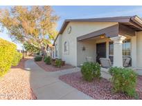 Well-maintained house exterior with walkway and landscaping at 8140 N 107Th Ave # 129, Peoria, AZ 85345