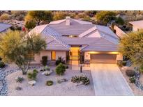 Single story home with desert landscaping and two car garage at 7438 E Visao Dr, Scottsdale, AZ 85262