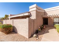 Inviting exterior of a condo with a walkway and landscaping at 3030 S Alma School Rd # 12, Mesa, AZ 85210