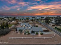 Stunning aerial view of a modern home with a spacious backyard and landscaped front yard at 394 E Redfield Rd, Chandler, AZ 85225