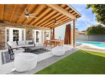 Covered patio features comfortable seating and dining areas at 8620 E San Miguel Ave, Scottsdale, AZ 85250