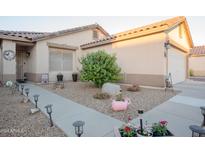 Landscaped front yard with stone pathway, and drought-tolerant plants at 664 W Jardin Dr, Casa Grande, AZ 85122