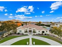 Luxury estate home with a large front yard and mountain views at 2335 E Plum St, Gilbert, AZ 85298