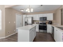 Modern kitchen with stainless steel appliances and island at 8840 W Villa Rita Dr, Peoria, AZ 85382