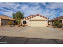 Single-story house with attached garage and desert landscaping at 13652 W Fargo Dr, Surprise, AZ 85374