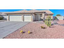 Single-story home with desert landscaping and a two-car garage at 20058 N 109Th Dr, Sun City, AZ 85373