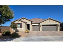 Single-story home with two-car garage and desert landscaping at 22446 E Russet Rd, Queen Creek, AZ 85142