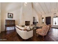 Elegant living room featuring a stunning fireplace and hardwood floors at 6701 N Scottsdale Rd # 20, Scottsdale, AZ 85250