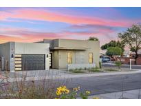 Stunning curb appeal with a modern facade and nicely manicured landscaping at 3125 N 86Th Pl, Scottsdale, AZ 85251
