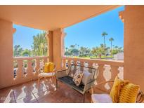 Relaxing balcony overlooking a lush green landscape at 7820 E Camelback Rd # 209, Scottsdale, AZ 85251
