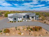 Luxury home with desert landscaping and a circular driveway; mountain views at 16426 E Pinnacle Vista Dr, Scottsdale, AZ 85262