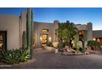 Stunning Southwestern-style home with a landscaped front yard and desert plants at 10040 E Happy Valley Rd # 504, Scottsdale, AZ 85255