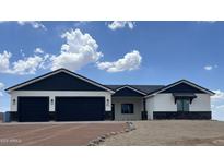 Modern two-story home with a two-car garage and landscaped yard at 4237 E 4Th Ave, Apache Junction, AZ 85119