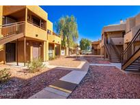 Apartment complex with walkway and landscaping at 11640 N 51St Ave # 250, Glendale, AZ 85304