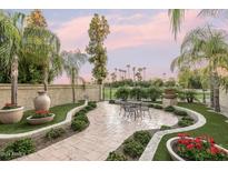 Landscaped patio with seating area, perfect for outdoor entertaining at 4710 N 65Th St, Scottsdale, AZ 85251