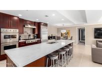 Modern kitchen with stainless steel appliances and an island at 7137 E Rancho Vista Dr # 2002, Scottsdale, AZ 85251