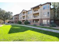 Three-story building with manicured lawn at 14950 W Mountain View Blvd # 1310, Surprise, AZ 85374