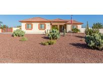 Single-story home with desert landscaping and a three-car garage at 30124 W Mckinley St, Buckeye, AZ 85396