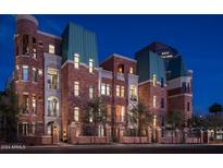 Luxury brick building with a unique architectural design, offering multiple units at 46 W Palm Ln, Phoenix, AZ 85003
