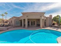 Stunning home exterior with pool and desert landscaping at 6162 E Redmont Dr, Mesa, AZ 85215