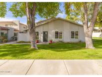 Updated single story home with front yard landscaping and walkway at 1026 N 85Th Pl, Scottsdale, AZ 85257