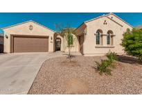 Single-story home with desert landscaping and two-car garage at 11122 E Tripoli Ave, Mesa, AZ 85212