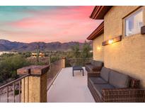 Spacious deck with wicker furniture and mountain views at 2724 S Falling Star Rd, Gold Canyon, AZ 85118