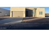 Single-story home with neutral exterior and two-car garage at 1278 W Calle Tuberia --, Casa Grande, AZ 85194
