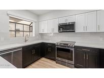 Modern kitchen with stainless steel appliances and quartz countertops at 6223 N 12Th St # 24, Phoenix, AZ 85014