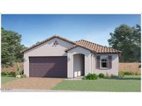 One-story home with a two-car garage and desert landscaping at 15640 W Winslow Ave, Goodyear, AZ 85338