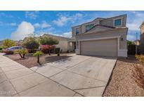 Two-story house with a large front yard, two-car garage, and neutral color scheme at 33242 N Jamie Ln, San Tan Valley, AZ 85144