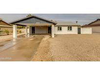 Updated single-story home with carport and neutral exterior at 544 E Morrow Dr, Phoenix, AZ 85024