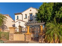 Beautiful two-story home with Spanish-style architecture and gated entry at 2004 E Heartwood Ln, Phoenix, AZ 85022