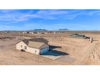 Aerial view of a house and garage in the desert at 37504 W Elm Ave, Tonopah, AZ 85354