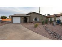 Charming single story home with a landscaped front yard at 723 W 5Th Ave, Apache Junction, AZ 85120