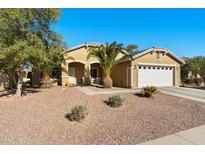 Single-story house with a two-car garage and desert landscaping at 1964 W Sawtooth Way, San Tan Valley, AZ 85144