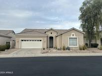 Single-story home with attached garage and desert landscaping at 4918 E Michigan Ave, Scottsdale, AZ 85254