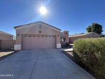 Single-story house with attached garage and desert landscaping at 3963 W Lariat Ct, Eloy, AZ 85131